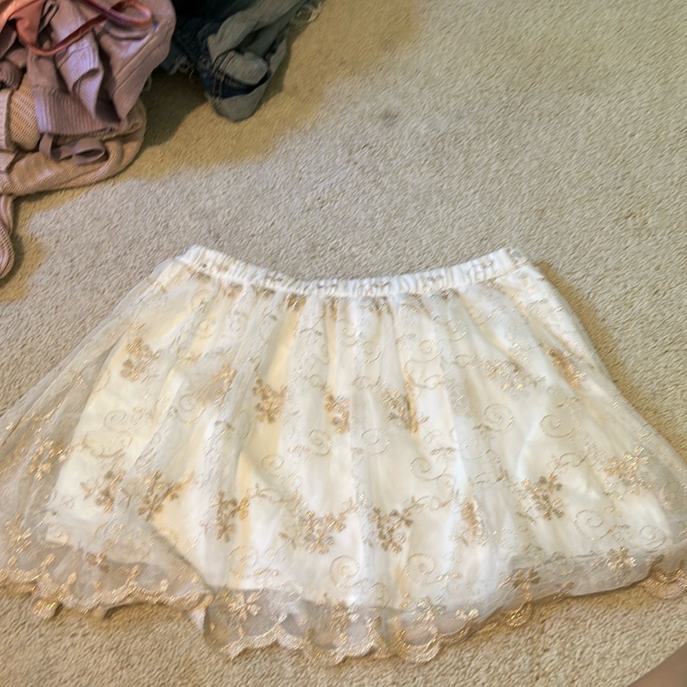 White skirt with gold detailing